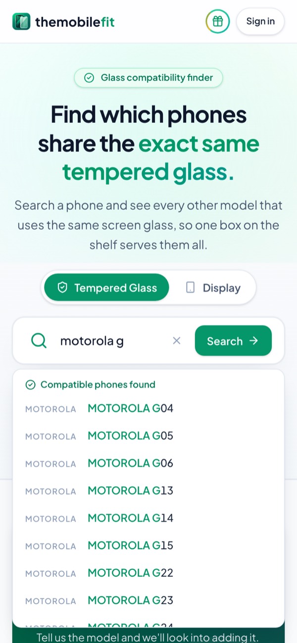 Typing motorola g in TheMobileFit's search box suggests Motorola phones under Compatible phones found, each opening its glass card.