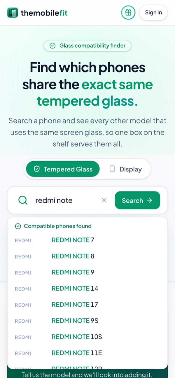 Typing redmi note in TheMobileFit's search box suggests Redmi phones under Compatible phones found, each opening its glass card.