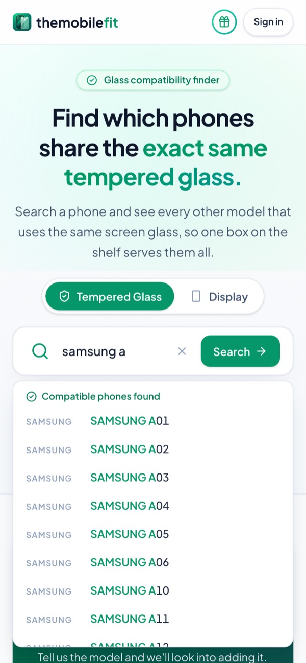 Typing samsung a in TheMobileFit's search box suggests Samsung phones under Compatible phones found, each opening its glass card.