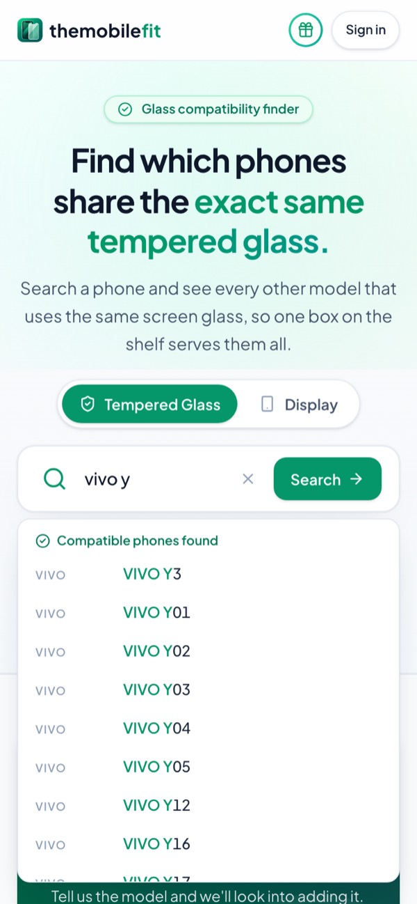 Typing vivo y in TheMobileFit's search box suggests Vivo phones under Compatible phones found, each opening its glass card.
